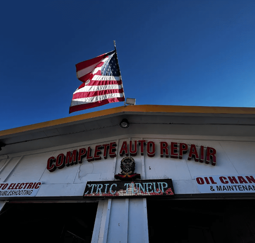 Auto repair shop with American flag.