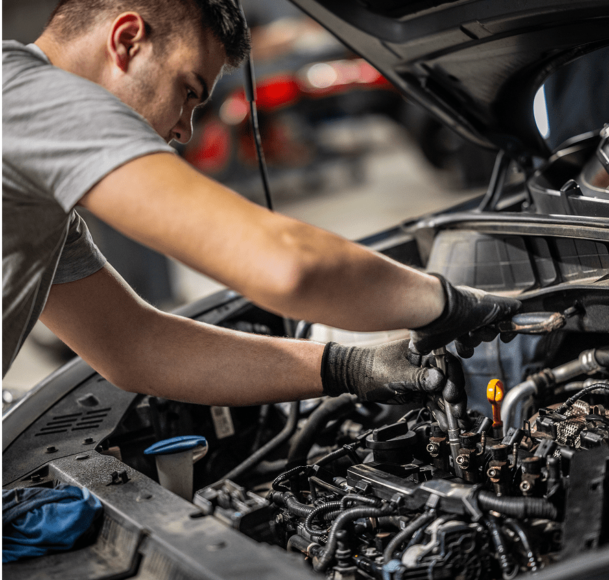 Mechanic working on a car engine.